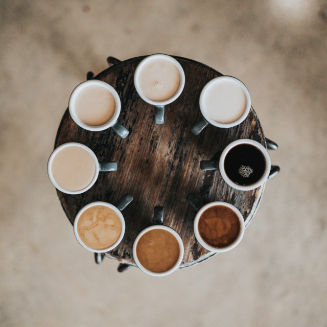 Coffee cups with different coffee shades